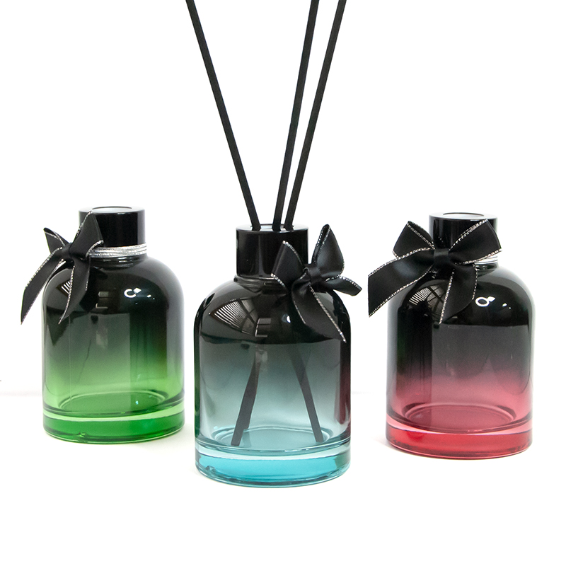 three custom colored glass bottle packaging with reed diffuser 01
