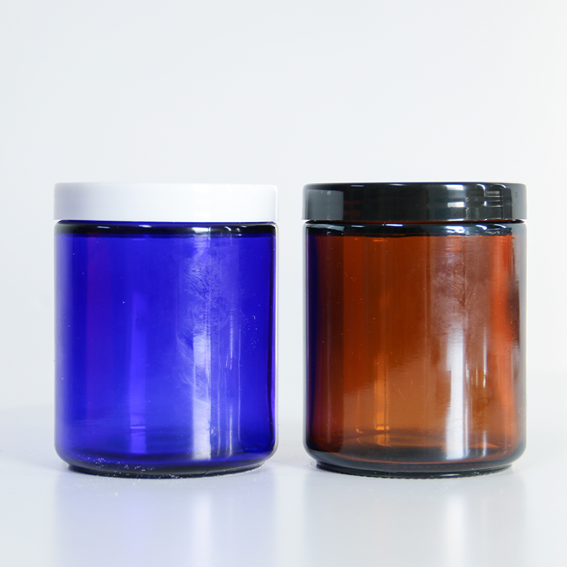 two close decorative candle packaging with screw on lid 01